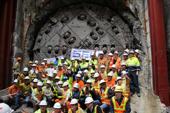 Workers celebrate the end of the 5.1km drive