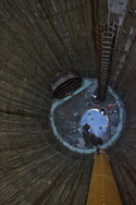 Looking down the Beckton overflow shaft during work on the domed base slab. Note diaphragm wall shaft lining and TBM inset